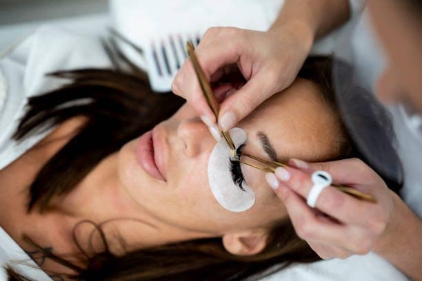 Close-up of eyelash extension application, one of the practical techniques taught at the Basic Certificate level