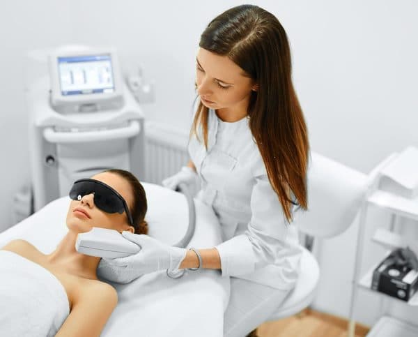 IPL laser treatment being delivered in a clinic setting, part of the Master level curriculum